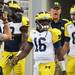 Michigan senior quarterback Denard Robinson leads the quarterbacks onto the field during warm ups at Cowboy Stadium in Arlington, Texas on Saturday. Melanie Maxwell I AnnArbor.com